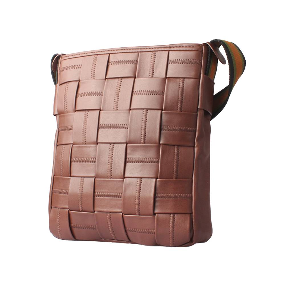 Side view of a brown woven leather crossbody bag, emphasizing the vertical woven pattern and striped shoulder strap.