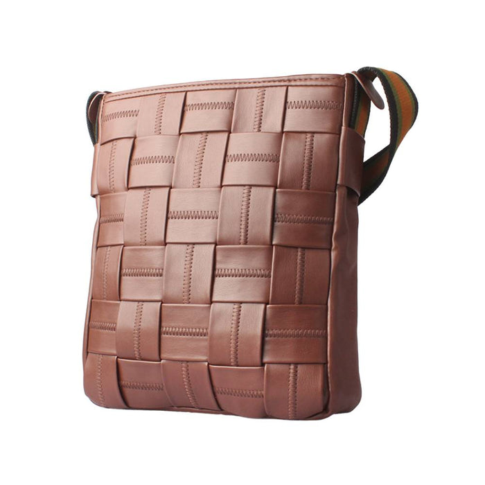 Side view of a brown woven leather crossbody bag, emphasizing the vertical woven pattern and striped shoulder strap.