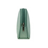 Side view of a small mint green zippered pouch with silver metal zipper pull, showing compact structured shape and precise stitching.