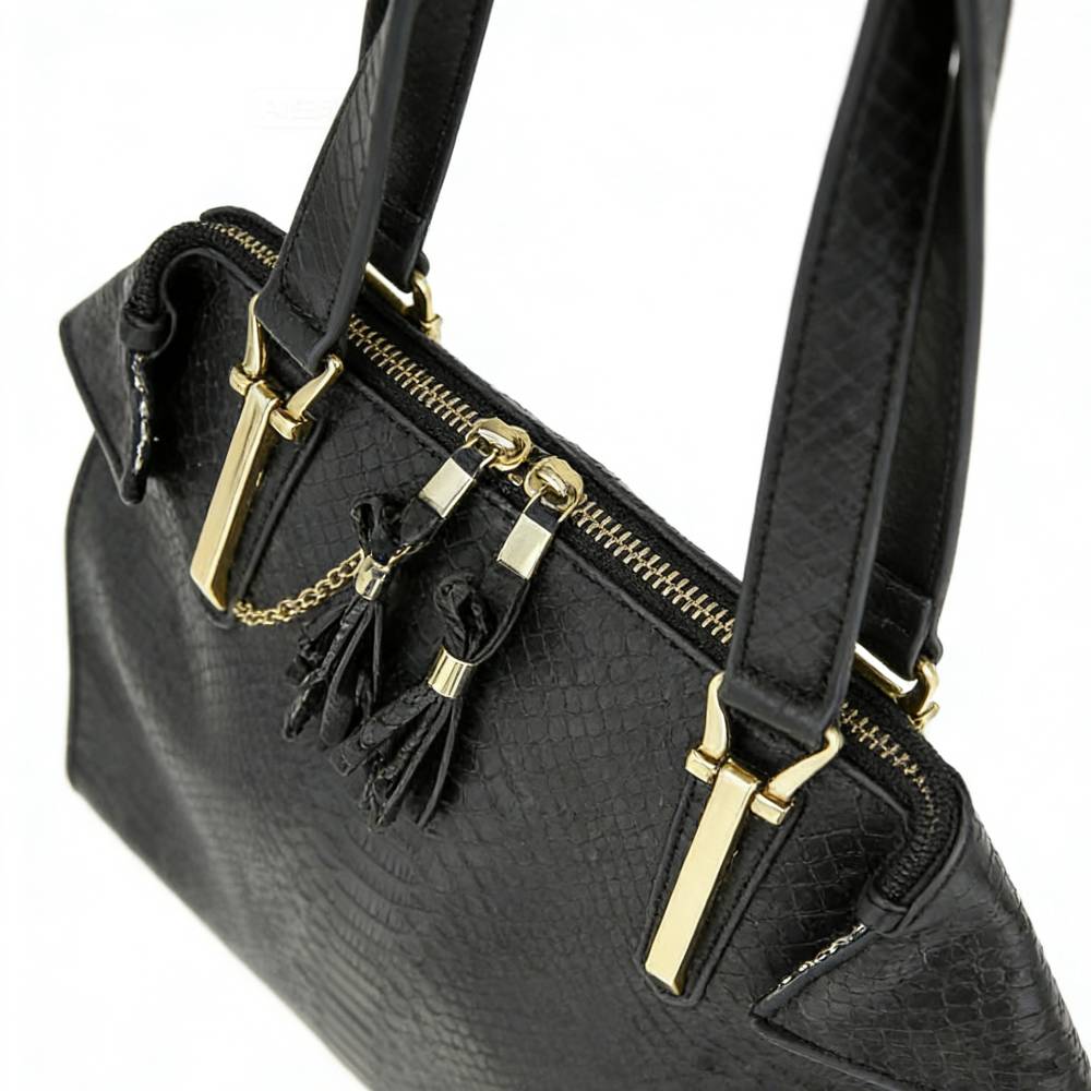 Black structured satchel bag with snakeskin embossing, gold hardware, and tassel details, professional work bag for women.