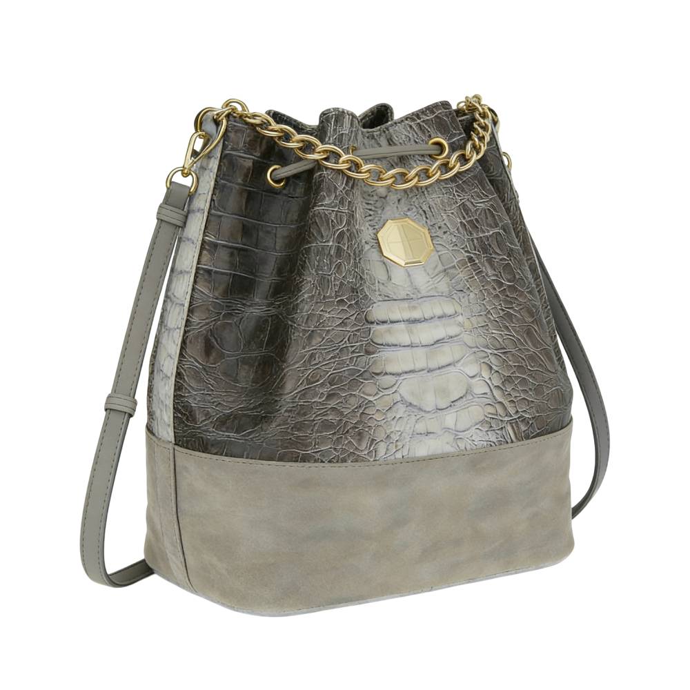 Side view of gray bucket bag with smooth suede-like base and crocodile-embossed upper, showing structured shape and spacious capacity.