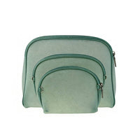 Side view of a small mint green zippered pouch with silver metal zipper pull, showing compact structured shape and precise stitching.