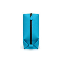 Front view of a bright blue toiletry bag with central black zipper closure and teal zipper pull, highlighting secure closure and sleek minimalist design.