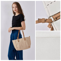 Spacious white/beige pebbled leather tote bag with brown leather handles, contrast stitching, and front zipper pocket, durable casual shoulder bag for wholesale and everyday use.
