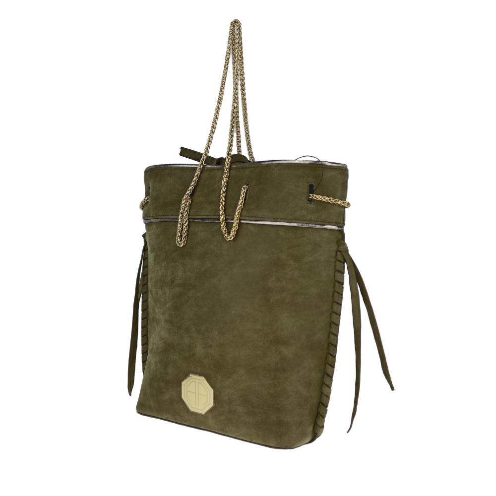 Side view of olive green suede tote bag with braided side tassels and metallic trim, showing spacious structured shape.
