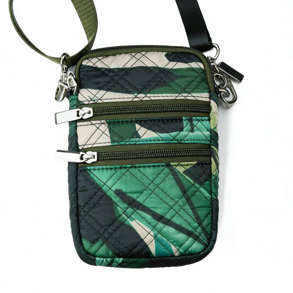 Front view of a green camouflage quilted crossbody phone bag with two front zipper pockets and silver metal hardware.
