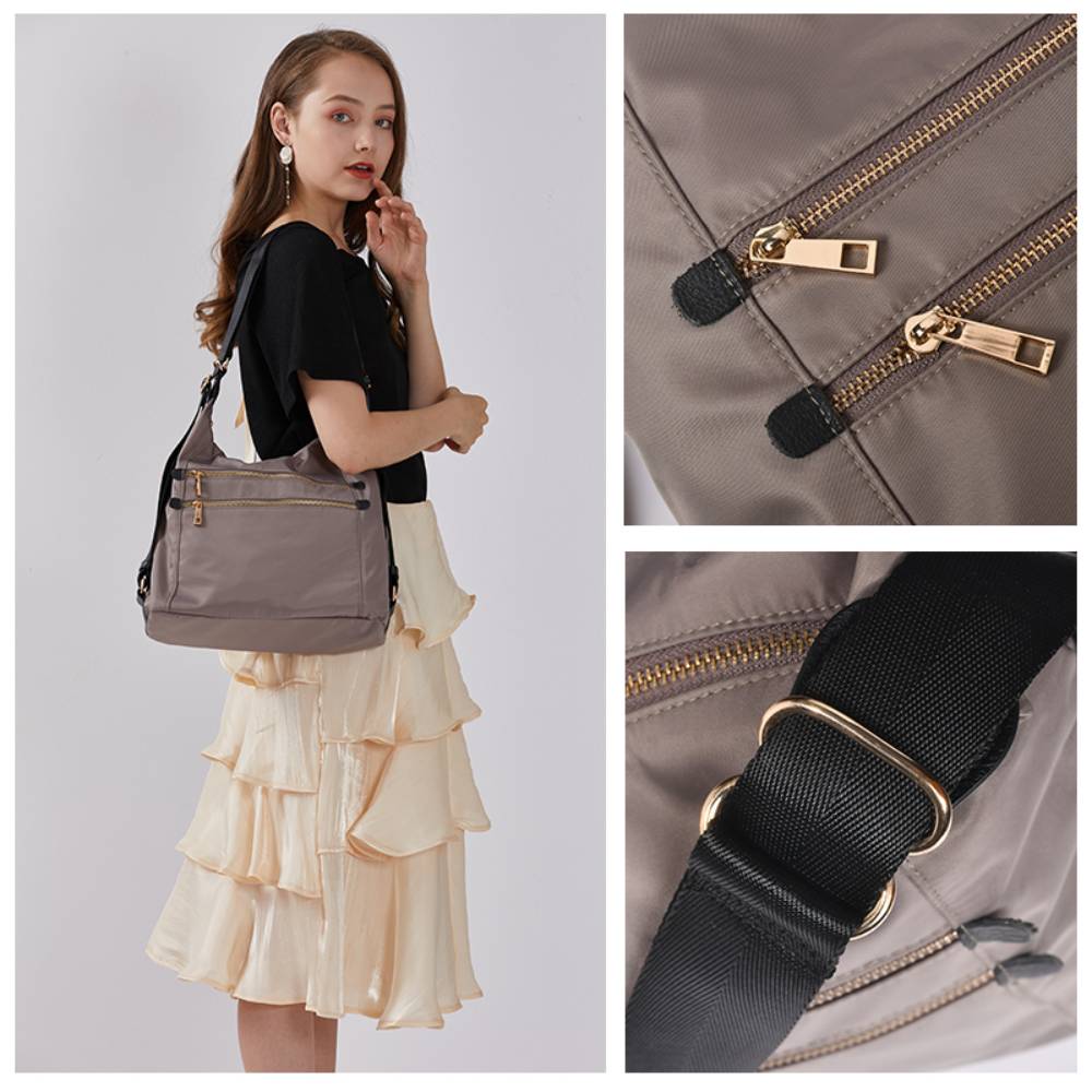 Close-up of gray nylon bag fabric and stitching, showing water-resistant material and precise craftsmanship.