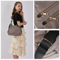 Close-up of gray nylon bag fabric and stitching, showing water-resistant material and precise craftsmanship.
