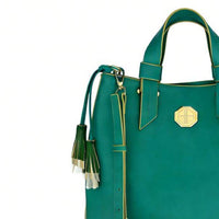 Close-up of adjustable teal leather crossbody strap with gold hardware, emphasizing functional and elegant design.