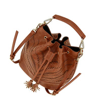 Tan leather drawstring bucket bag with geometric cut-out details, bohemian style shoulder purse for women.