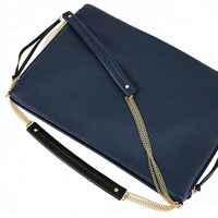 Navy blue pebbled leather clutch bag with gold chain crossbody strap, leather wristlet, and zipper closure, versatile durable evening shoulder bag for wholesale and everyday use.