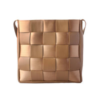 Front view of a tan woven crossbody bag with a checkered leather-webbing pattern, ideal for product listing and wholesale catalogs.