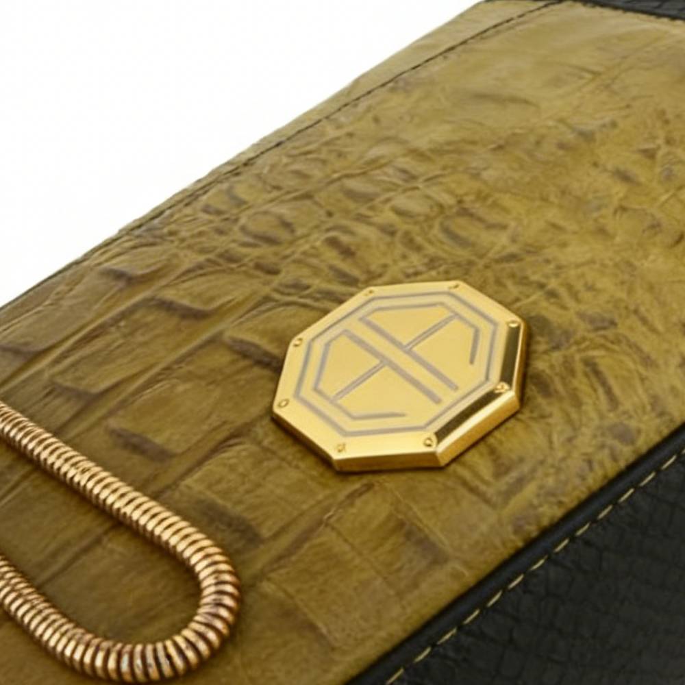 Close-up of gold snake chain strap attachment, showcasing sturdy and luxurious hardware design.