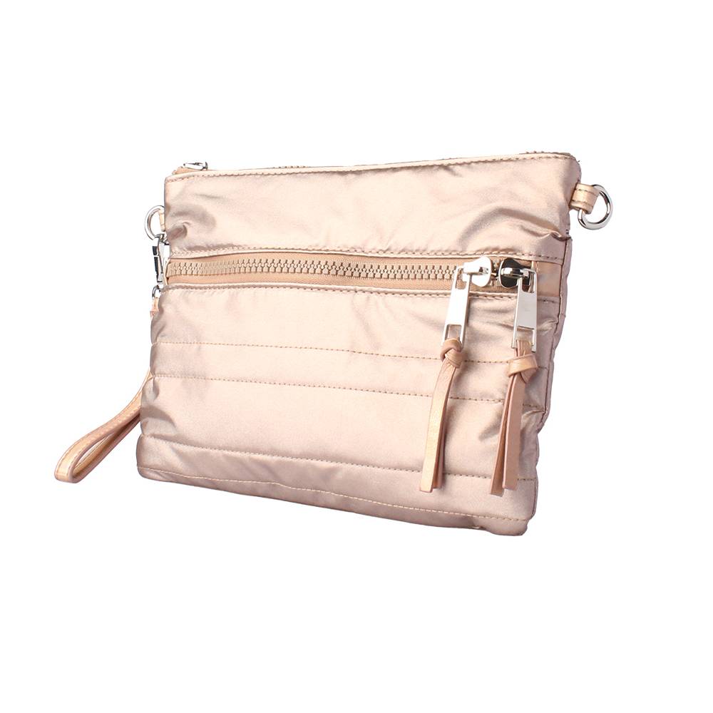 Front angled view of a rose gold puffy quilted crossbody bag, featuring a front zippered pocket, leather wristlet strap, and silver D-ring hardware.