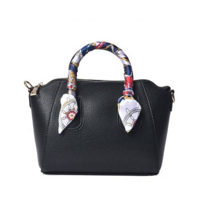 Front view of a black pebbled leather satchel handbag with a decorative nautical scarf-wrapped handle, ideal for product listing and wholesale catalogs.