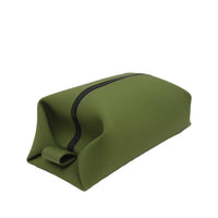 Olive green toiletry bag with black zipper and sleek rectangular design, offering a neutral color option for daily or travel use.
