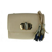 Side profile of beige leather crossbody clutch with gold chain and tassel details, showing compact structured shape.