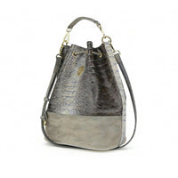 Back view of gray crocodile-embossed bucket bag with central vertical panel, highlighting symmetrical design and durable stitching.