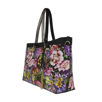Floral pattern tote bag with black handles, gold octagonal emblem, and tassel accents, casual fashion work bag for women.