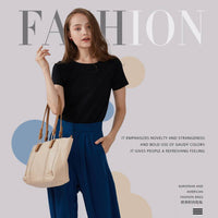 Model wearing a spacious beige tote bag with contrast stitching, versatile design for daily essentials and wholesale.